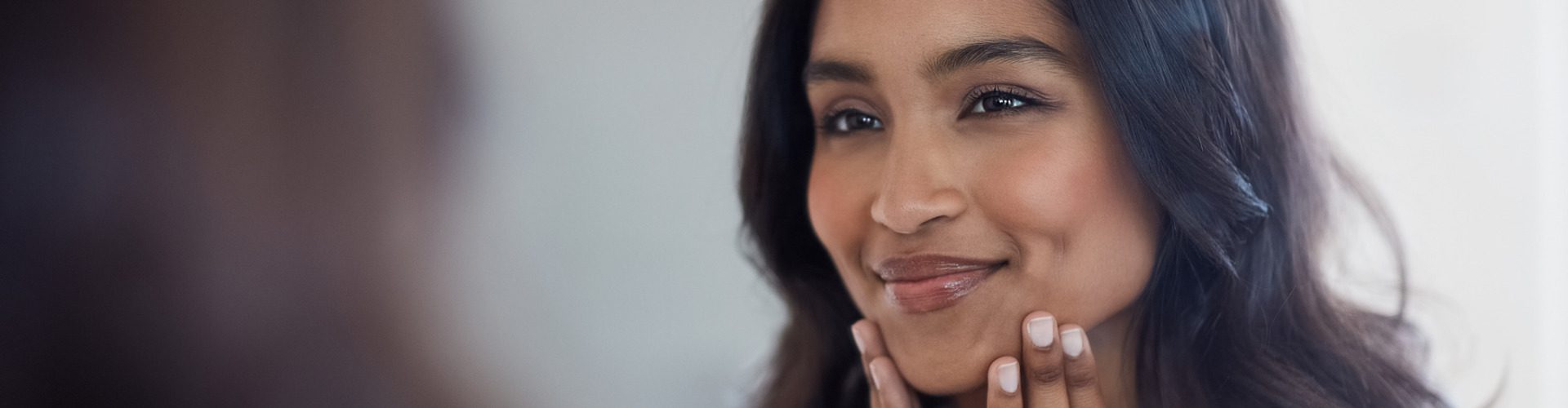 Woman enjoying result of collagen boosting fillers