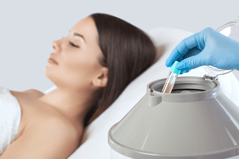 Specialist using a centrifuge for PRP